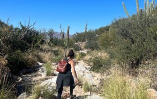 Close-up of a female walking through a wash in Tuscon Arizona getting her brand in shape